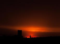 The second stage of the industrial sunset above the Silesian coal mine Bielszowice ( KWK Bielszowice ) in Ruda Śląska. Photo was taken from Katowice, about 15 kilometers away.